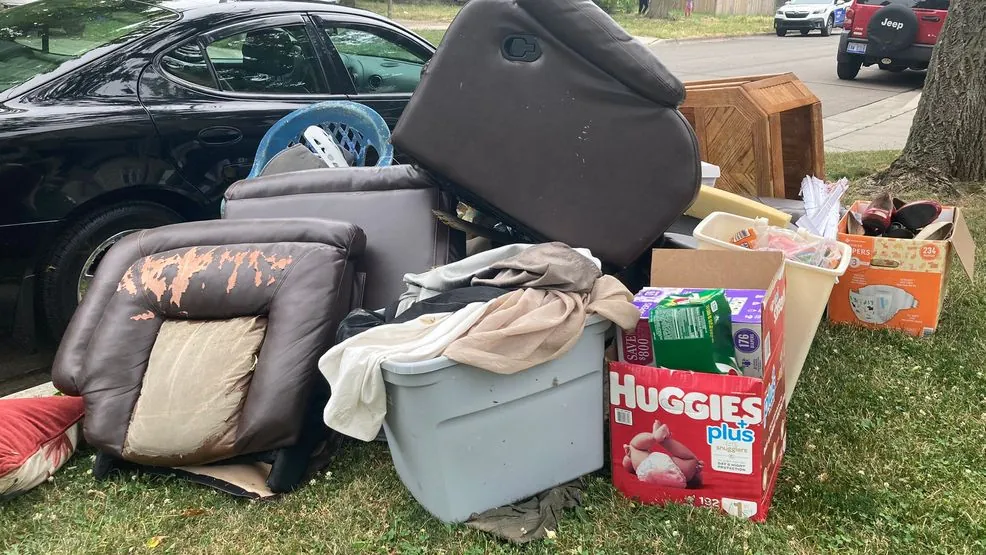 A pile of household junk staged at the curb ready for removal